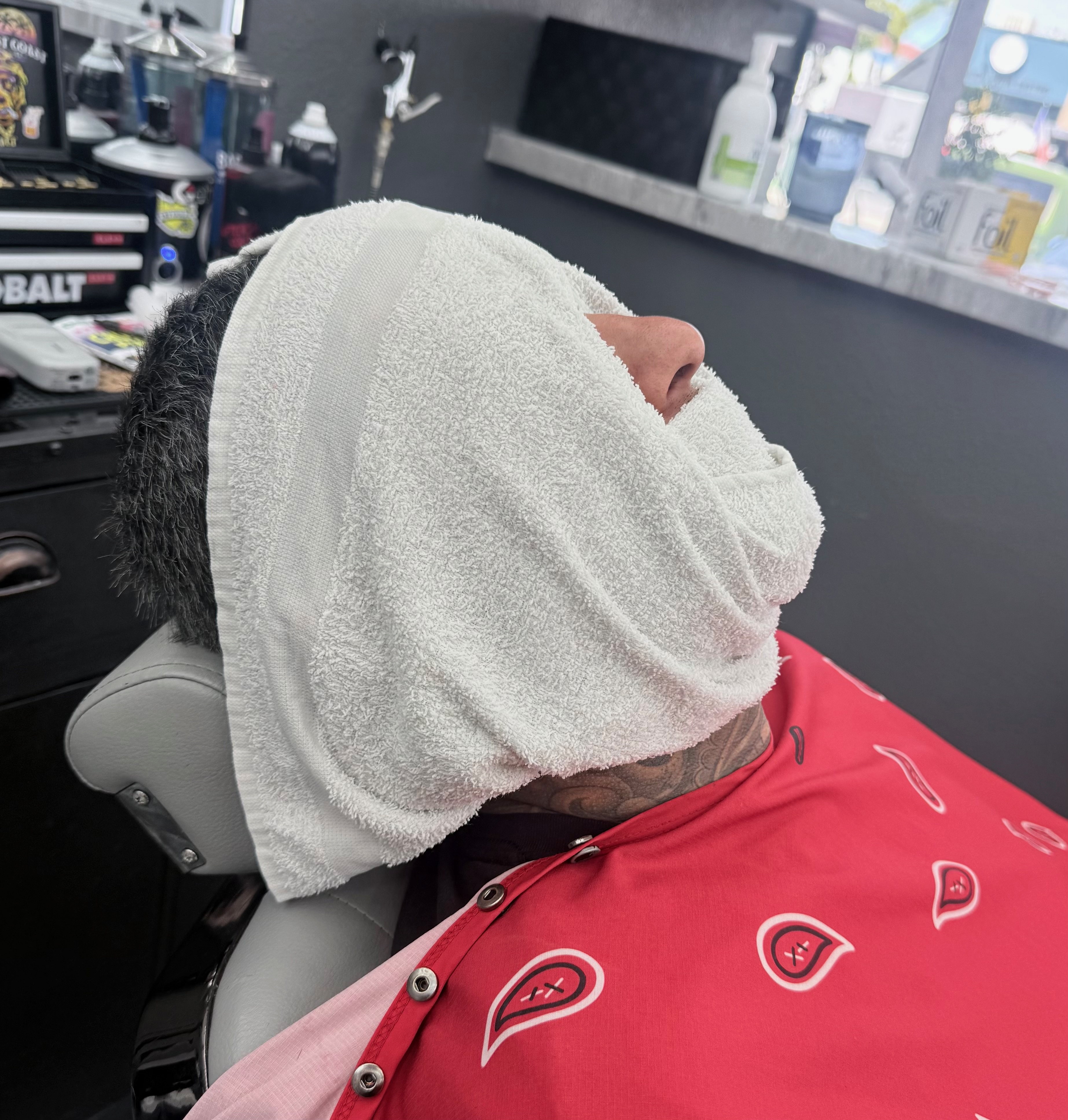 Hot towel service at Defined Cuts